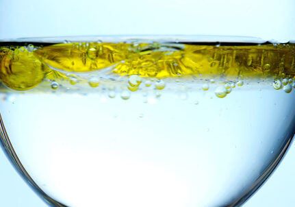 Cooking oil in glass of water